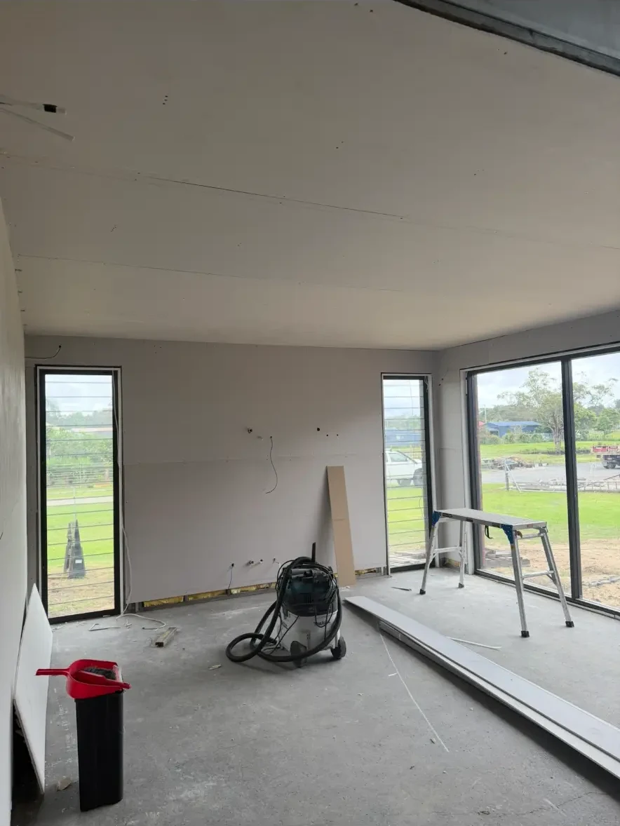 Freshly plastered living room with square set ceiling
